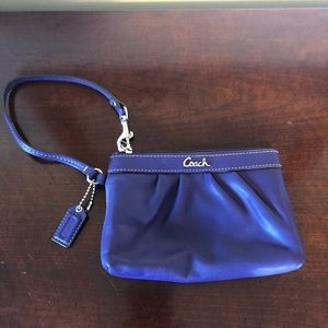 Coach purple wristlet. Excellent condition.